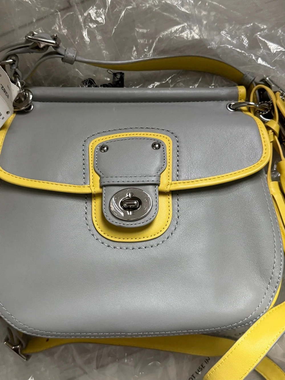 Coach Brand new Gray and Yellow Leather Crossbody Bag with Tassel